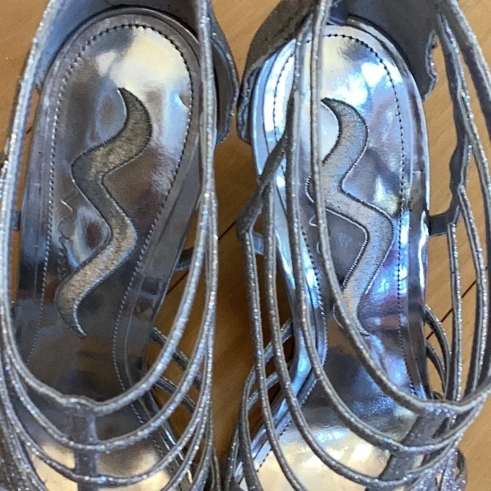 Nina silver glittery, strappy high heels, zipper to back. Women’s size 7